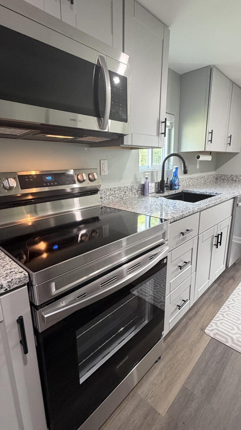 Kitchen with full stove, fridge, dishwasher
